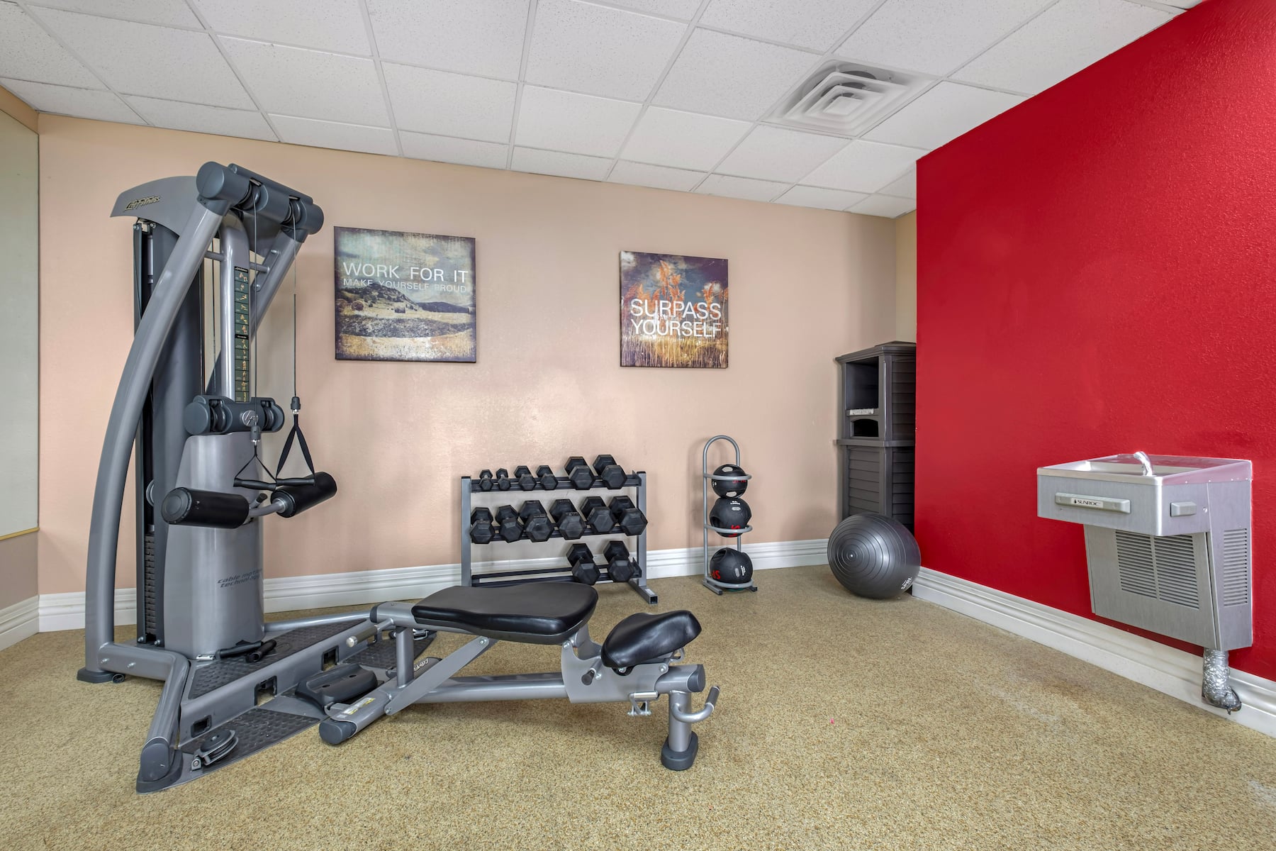 Hotel fitness center with strength equipment and free weights