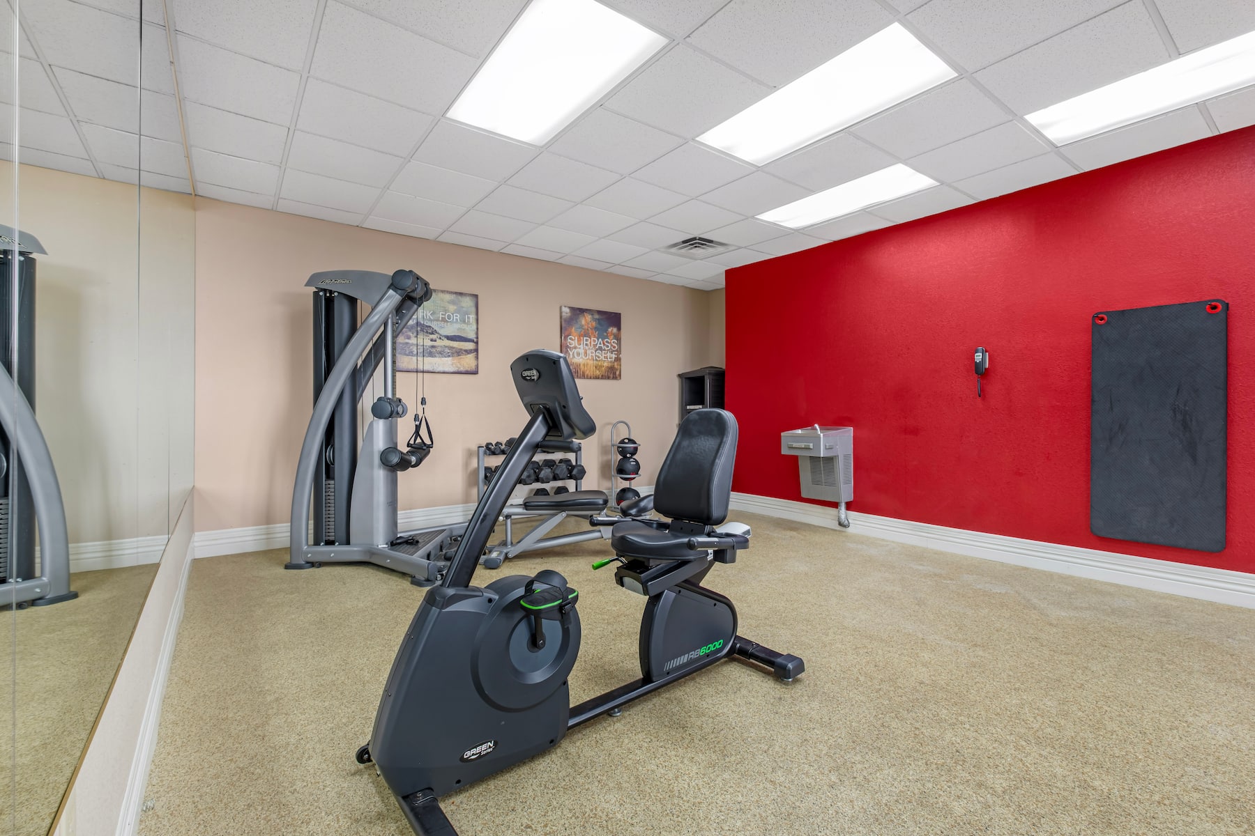 Hotel fitness center with strength equipment and free weights
