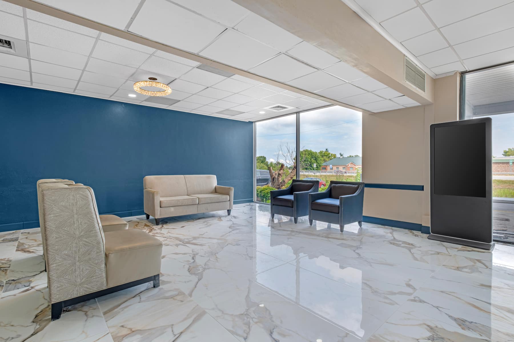 Hotel lobby seating area with large windows